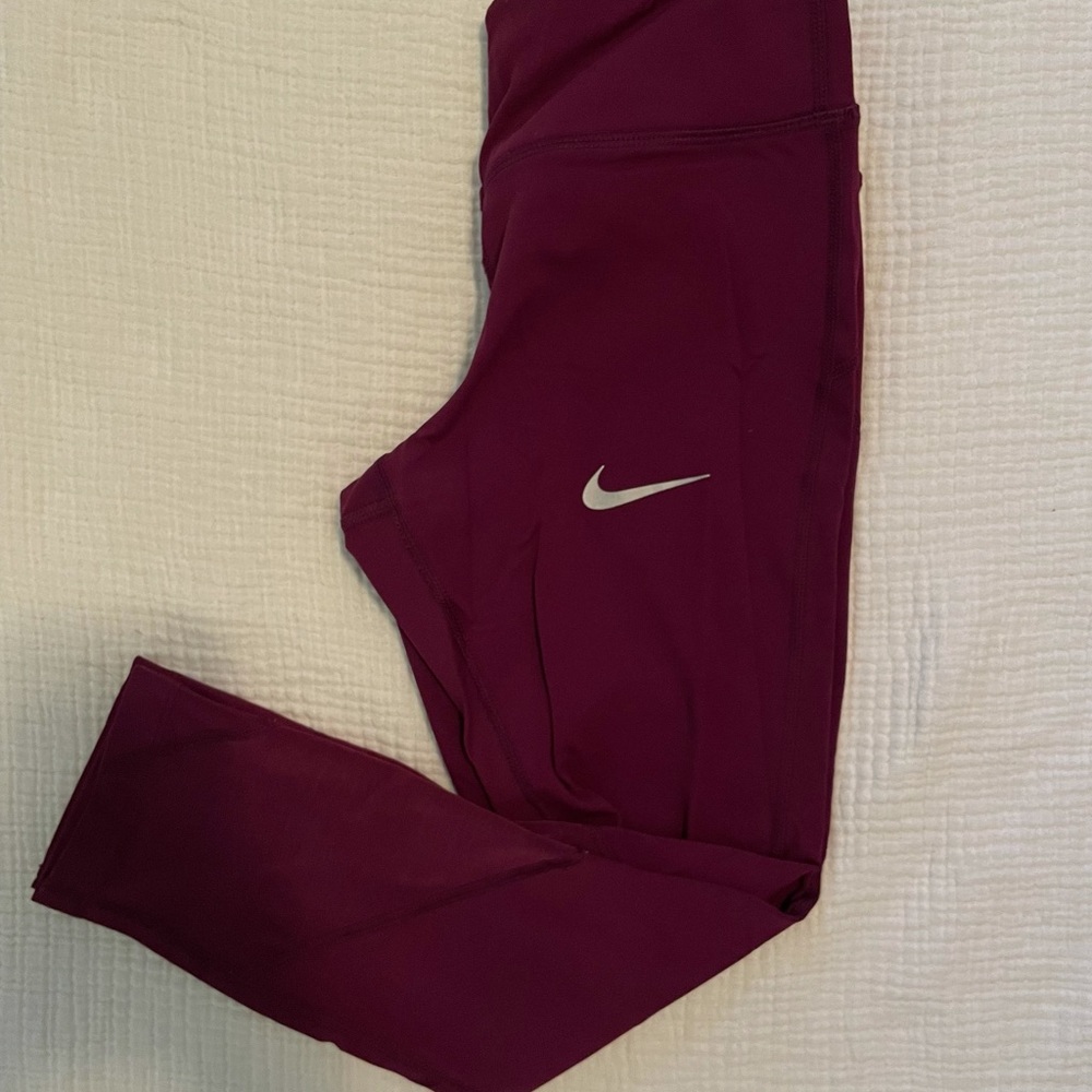 Nike leggings with a vibrant color and mesh detail